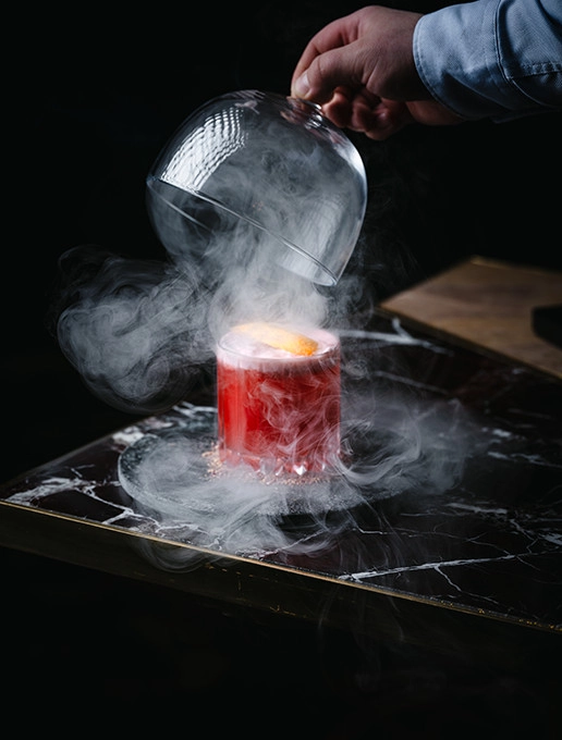 Smoldering pink cocktail served at Dans le Noir ?